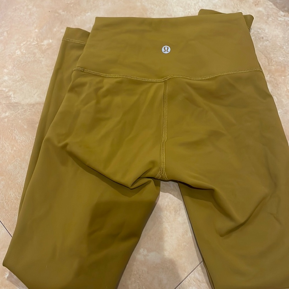 Size 2 never worn lululemon mustard yellow leggings